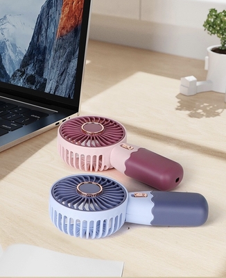 Creative Cartoon Mini Handheld Cooling Piccolo Ventilatore Portatile USB di ricarica del telefono Stand Piccolo Ventilatore 2024 RAMADAN Prodotto